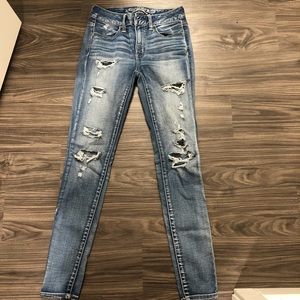 Acid wash light ripped jeans